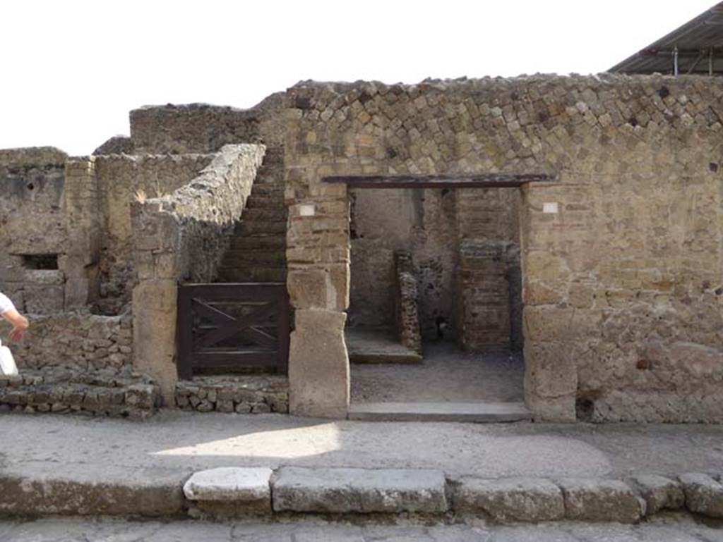 III.4 Herculaneum, on right. October 2014. Looking east to doorways. III.5 leads to the stairs, on the left. Photo courtesy of Michael Binns.